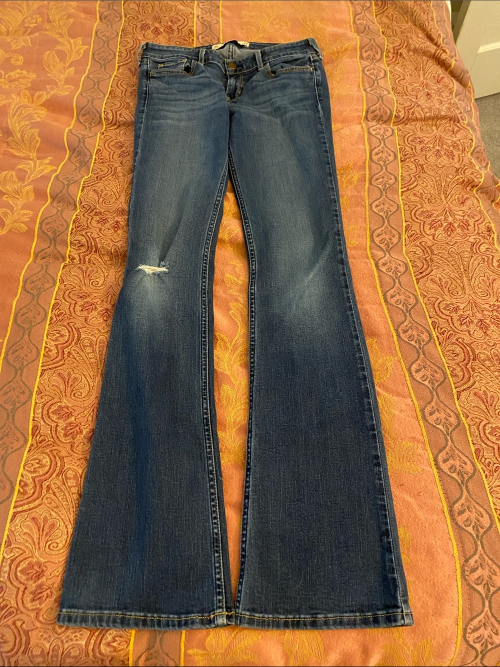 Hollister Dark Blue Bootcut Jeans with Slight distress on left knee